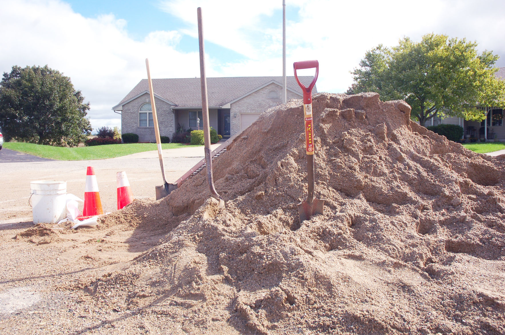 Sand and shovels Oak Knolls flooding Walworth